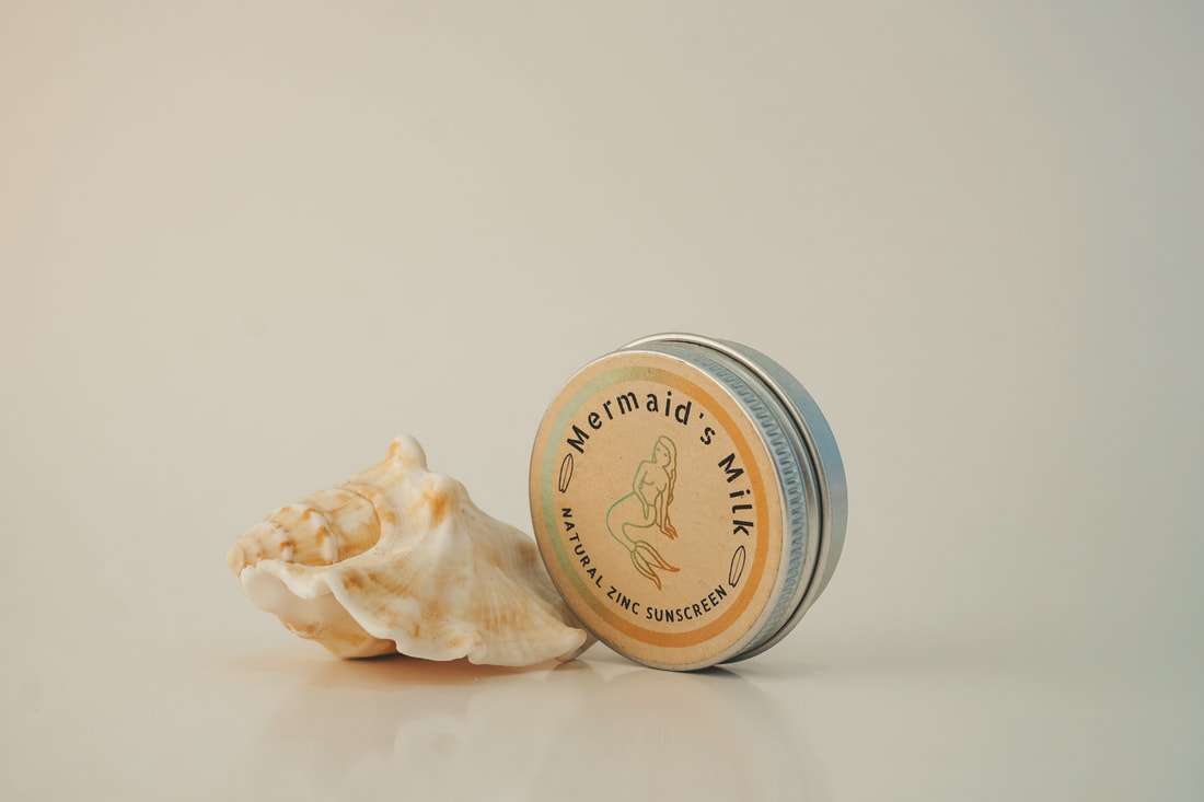 SUNSCREEN AND SHELL ON WHITE BOX PRODUCT PHOTOGRAPHY AND LIFESTYLE CREATION